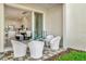 Private patio with seating area, view to kitchen at 31879 Anchor Point Dr, Wesley Chapel, FL 33545