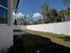 Private backyard with patio and white vinyl fence at 5549 97Th N Ter, Pinellas Park, FL 33782