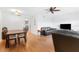 Living room with hardwood floors, leather furniture and dining area at 1950 59Th N Ave # 318, St Petersburg, FL 33714