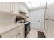 Efficient kitchen with ample cabinetry and modern appliances at 1950 59Th N Ave # 318, St Petersburg, FL 33714