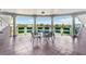 Circular balcony with table and chairs overlooking a lake at 1950 59Th N Ave # 318, St Petersburg, FL 33714