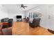 Bright living room with hardwood floors, comfy seating, and a ceiling fan at 1950 59Th N Ave # 318, St Petersburg, FL 33714