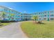 Exterior view of mid-century modern building with landscaping at 1950 59Th N Ave # 318, St Petersburg, FL 33714
