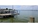 Wooden dock with boat lifts, providing convenient access to the water at 15301 Harbor Dr, Madeira Beach, FL 33708