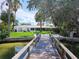 Charming waterfront home with a large backyard, dock, and lush landscaping at 15301 Harbor Dr, Madeira Beach, FL 33708