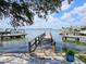 Private wooden dock offering serene waterfront views and access to the water at 15301 Harbor Dr, Madeira Beach, FL 33708