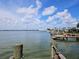 Waterfront property showcasing a wooden dock and tranquil water views at 15301 Harbor Dr, Madeira Beach, FL 33708