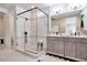 Spa-like bathroom with a large walk-in shower and double vanity at 31885 Anchor Point Dr, Wesley Chapel, FL 33545