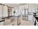 Modern kitchen with stainless steel appliances and a farmhouse sink at 31885 Anchor Point Dr, Wesley Chapel, FL 33545