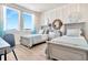 Twin bedroom with light blue bedding and plenty of natural light at 31885 Anchor Point Dr, Wesley Chapel, FL 33545