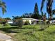 Ranch style home with carport and mature lawn at 5323 Carlton Rd, New Port Richey, FL 34652