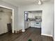 Simple kitchen with white cabinets and flooring at 5323 Carlton Rd, New Port Richey, FL 34652