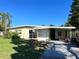 Ranch style home with carport and mature lawn at 5323 Carlton Rd, New Port Richey, FL 34652