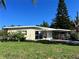 Ranch style home with carport and mature lawn at 5323 Carlton Rd, New Port Richey, FL 34652