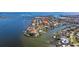 Gorgeous aerial view of the property with waterfront access and close proximity to a bridge at 165 4Th N Ave, Tierra Verde, FL 33715