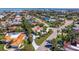 Aerial view showing the home's location, neighborhood, and the surrounding landscaping and well manicured lawn at 165 4Th N Ave, Tierra Verde, FL 33715