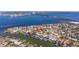 A beautiful neighborhood viewed from above, with a waterfront view and lush landscaping at 165 4Th N Ave, Tierra Verde, FL 33715
