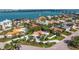Stunning waterfront property featuring lush landscaping, a spacious layout, and screened pool at 165 4Th N Ave, Tierra Verde, FL 33715