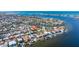 A stunning aerial view of waterfront homes, showcasing a picturesque neighborhood with boat docks at 165 4Th N Ave, Tierra Verde, FL 33715