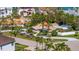 Stunning aerial view of single story waterfront property, lush landscaping, pool, and convenient street access at 165 4Th N Ave, Tierra Verde, FL 33715