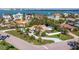 Aerial view of a waterfront home showcasing lush landscaping, a private pool and easy access to Sarasota Bay at 165 4Th N Ave, Tierra Verde, FL 33715