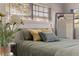 Close-up of a bedroom with a comfortable bed, stylish pillows, and natural light from the window at 165 4Th N Ave, Tierra Verde, FL 33715