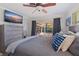 Bedroom with patio access with sliding glass door overlooking the pool and an installed ceiling fan at 165 4Th N Ave, Tierra Verde, FL 33715