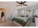 Comfortable bedroom with neutral tones, plush pillows, and a view of the exterior at 165 4Th N Ave, Tierra Verde, FL 33715