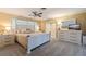 Bedroom with white furniture, neutral color scheme, and carpeted floor at 165 4Th N Ave, Tierra Verde, FL 33715