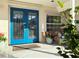 Charming home entrance featuring double doors, a well-maintained front yard and ample natural light at 165 4Th N Ave, Tierra Verde, FL 33715