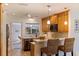 Bright, updated kitchen featuring custom cabinets, modern appliances, and a functional breakfast bar at 165 4Th N Ave, Tierra Verde, FL 33715