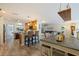 Open-concept kitchen with bar seating, views into the living room at 165 4Th N Ave, Tierra Verde, FL 33715
