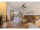 Cozy living room featuring a stone fireplace, wood floors, and a comfortable couch at 165 4Th N Ave, Tierra Verde, FL 33715