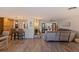 Inviting living space featuring a stone fireplace, wood floors, and an open floor plan at 165 4Th N Ave, Tierra Verde, FL 33715