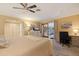 Bedroom featuring closet, desk and access to the outdoor living area at 165 4Th N Ave, Tierra Verde, FL 33715