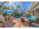 Charming screened-in pool area featuring comfortable seating, perfect for entertaining guests at 165 4Th N Ave, Tierra Verde, FL 33715