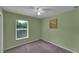 Cozy bedroom with a large window providing plenty of natural light and a peaceful atmosphere at 2857 Brewster Rd, North Port, FL 34288