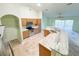 A kitchen features a spacious island, tile floors, stainless steel appliances and light-colored cabinets at 2857 Brewster Rd, North Port, FL 34288