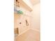 The laundry room has tile floors, wire shelving, and hookups for a washer and dryer at 2857 Brewster Rd, North Port, FL 34288