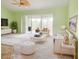 The brightly-lit living room features contemporary furniture, neutral walls, and sliding glass doors at 2857 Brewster Rd, North Port, FL 34288