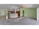 Open-concept living room and kitchen with tile floors and ample space for entertaining at 2857 Brewster Rd, North Port, FL 34288