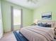 Calming primary bedroom featuring a plush bed, soft lighting, and a serene ambiance at 2857 Brewster Rd, North Port, FL 34288