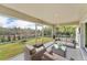 Screened-in patio with comfortable seating offers serene outdoor living and views at 2857 Brewster Rd, North Port, FL 34288