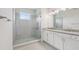 Modern bathroom with a glass-enclosed shower, granite countertops, and contemporary fixtures at 31895 Anchor Point Dr, Wesley Chapel, FL 33545