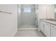 Modern bathroom with a glass-enclosed shower, granite countertops, and contemporary fixtures at 31895 Anchor Point Dr, Wesley Chapel, FL 33545