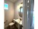 Half bath with pedestal sink and modern fixtures at 31895 Anchor Point Dr, Wesley Chapel, FL 33545