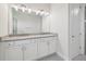 Bathroom with double sink vanity with gray granite countertop at 31895 Anchor Point Dr, Wesley Chapel, FL 33545