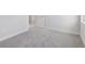 Bright bedroom with gray carpet and a doorway and window at 31895 Anchor Point Dr, Wesley Chapel, FL 33545