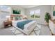 Staged bedroom featuring natural light, modern decor, and a comfortable, stylish aesthetic at 31895 Anchor Point Dr, Wesley Chapel, FL 33545