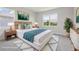Staged bedroom featuring natural light, modern decor, and a comfortable, stylish aesthetic at 31895 Anchor Point Dr, Wesley Chapel, FL 33545